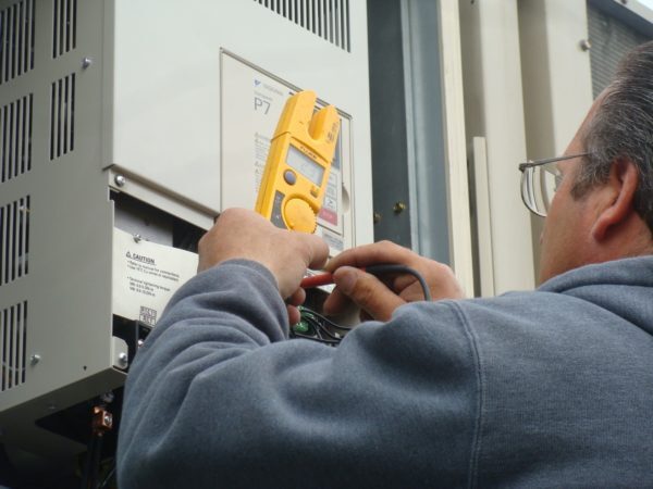tech with hvac tool