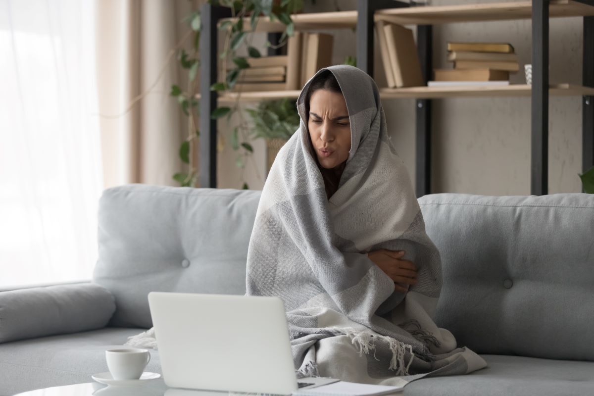 bundled up on couch